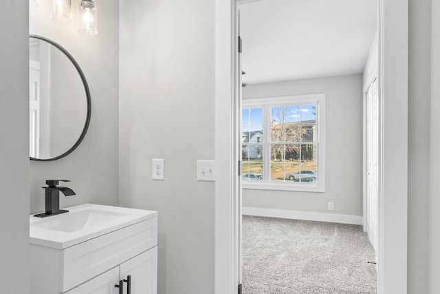 bathroom featuring vanity and baseboards