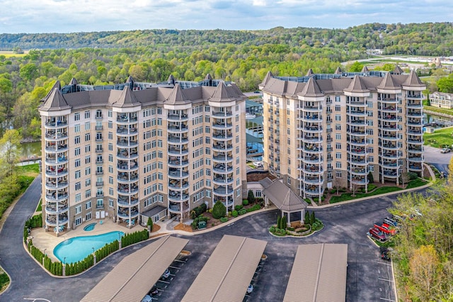 birds eye view of property with a wooded view