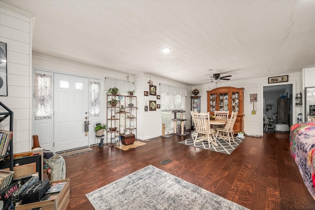 interior space featuring ceiling fan and wood finished floors