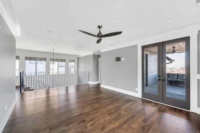 unfurnished living room with baseboards, dark wood-style floors, ceiling fan, ornamental molding, and french doors