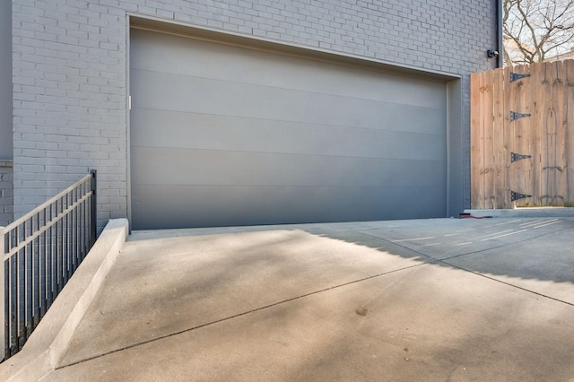 garage with concrete driveway