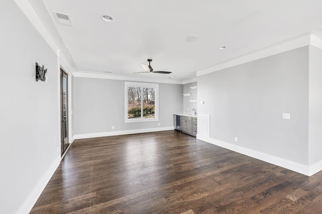 unfurnished living room featuring dark wood-type flooring, visible vents, and baseboards