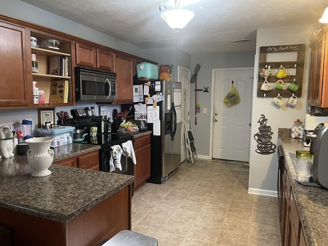 kitchen featuring black electric range, fridge with ice dispenser, open shelves, stainless steel microwave, and dark countertops