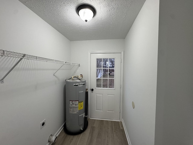 utility room featuring water heater