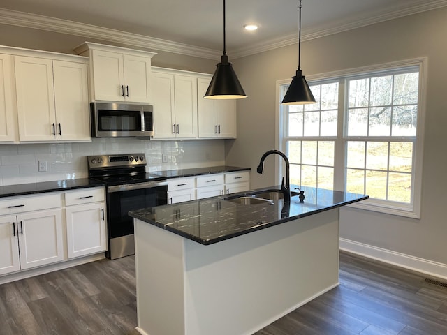 kitchen featuring a sink, appliances with stainless steel finishes, backsplash, a wealth of natural light, and crown molding