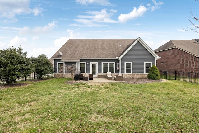 rear view of property featuring a yard, a fenced backyard, and an outdoor living space