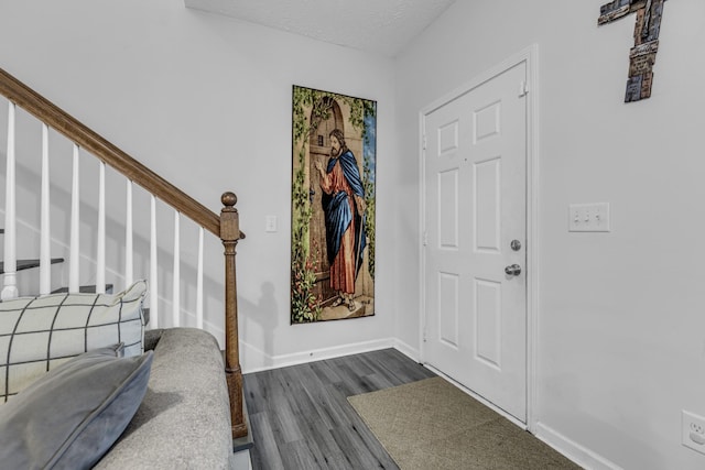 820 Lower Park Pl, Antioch, TN 37013 - foyer with a textured ceiling, stairs, baseboards, and dark wood-style flooring