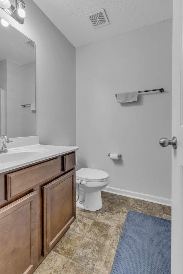 820 Lower Park Pl, Antioch, TN 37013 - bathroom with baseboards, visible vents, toilet, a textured ceiling, and vanity