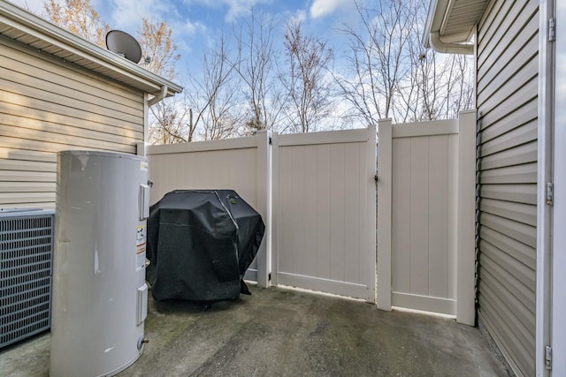 820 Lower Park Pl, Antioch, TN 37013 - view of patio / terrace with grilling area, a gate, fence, water heater, and central AC