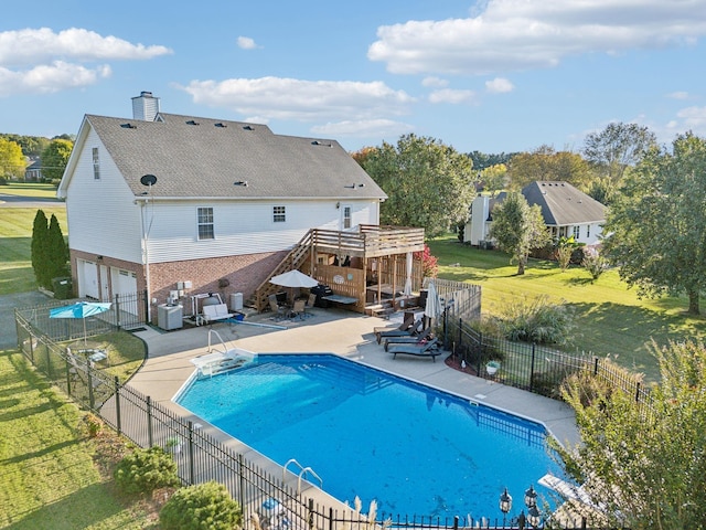 view of swimming pool with a fenced in pool, a fenced backyard, a lawn, and a patio