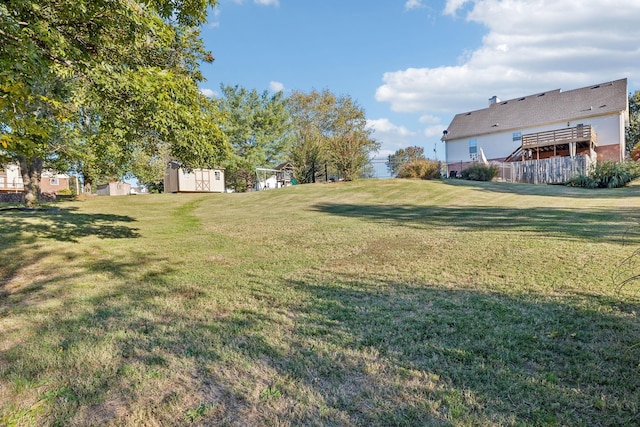 view of yard with an outdoor structure and a storage shed