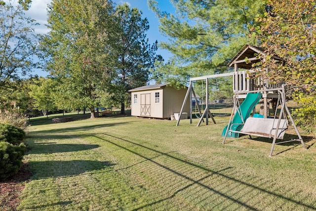 view of yard with an outbuilding, a shed, and a playground