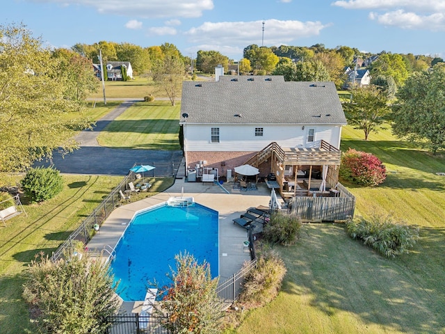 view of pool featuring a fenced backyard, a fenced in pool, a pergola, and a lawn