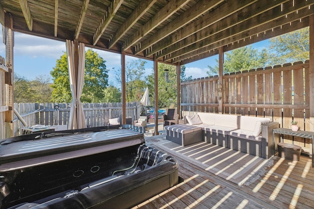 view of patio with a fenced backyard, an outdoor living space, and hot tub deck surround