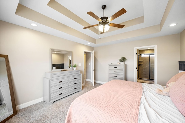 bedroom with recessed lighting, a raised ceiling, light colored carpet, and baseboards