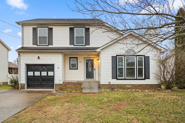 traditional home with a front lawn, crawl space, concrete driveway, and an attached garage