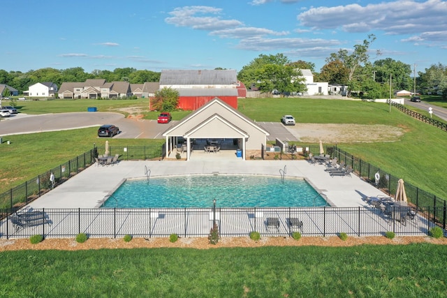 community pool with a gazebo, a lawn, a patio area, and fence