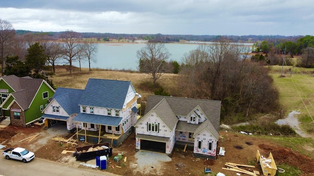 birds eye view of property featuring a water view