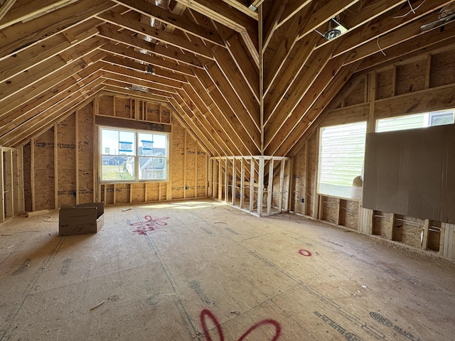 attic featuring a wealth of natural light