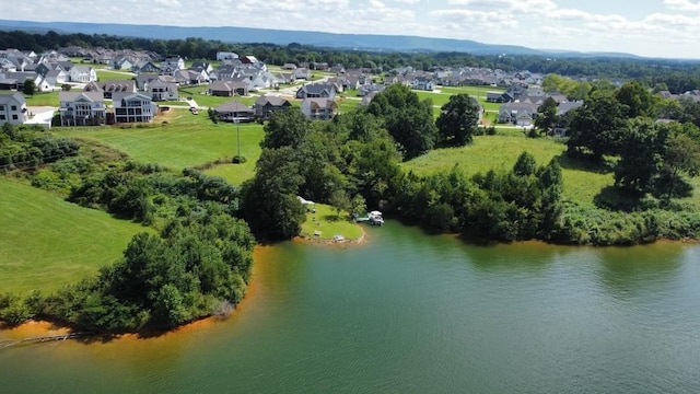 bird's eye view featuring a water view and a residential view