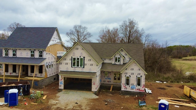 property in mid-construction featuring driveway and a garage