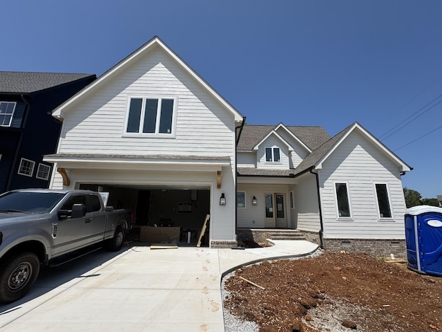 279 Hammock Dr, Winchester, TN 37398 - view of front of property featuring driveway, an attached garage, crawl space, and roof with shingles