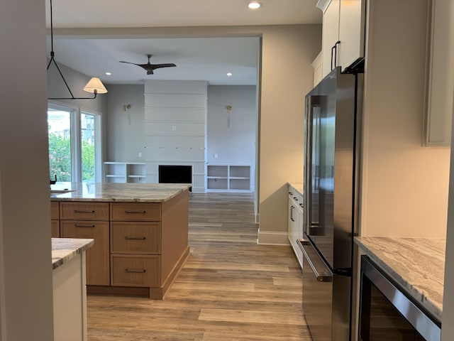 279 Hammock Dr, Winchester, TN 37398 - kitchen with freestanding refrigerator, wine cooler, light wood-style floors, ceiling fan, and recessed lighting