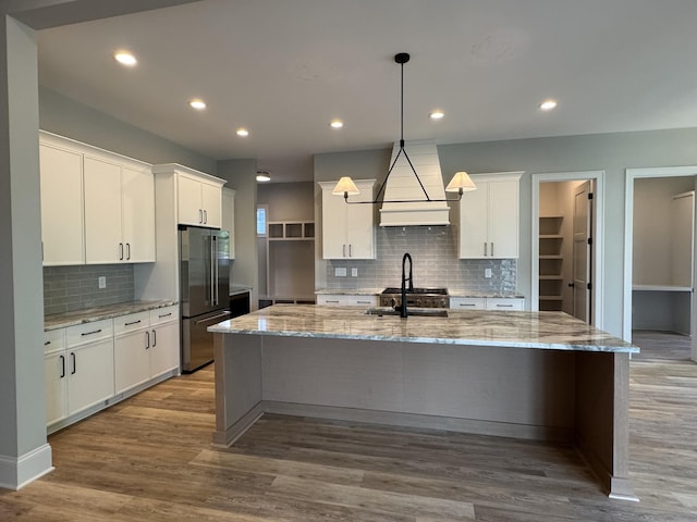 279 Hammock Dr, Winchester, TN 37398 - kitchen with high quality fridge, custom range hood, decorative backsplash, white cabinetry, and recessed lighting
