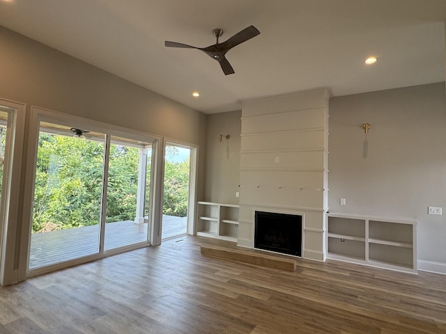 279 Hammock Dr, Winchester, TN 37398 - unfurnished living room featuring wood finished floors, ceiling fan, a fireplace, and recessed lighting