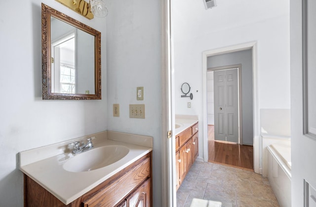 bathroom with visible vents and vanity