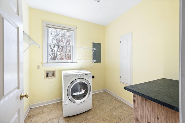 laundry area featuring light tile patterned flooring, laundry area, baseboards, electric panel, and washer / dryer