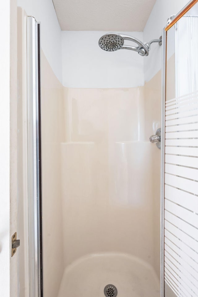 full bath featuring a stall shower