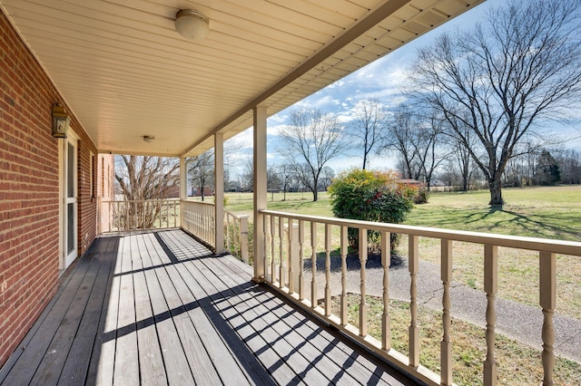 wooden deck with a yard