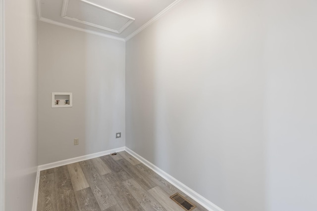 laundry area with laundry area, washer hookup, baseboards, light wood-type flooring, and attic access