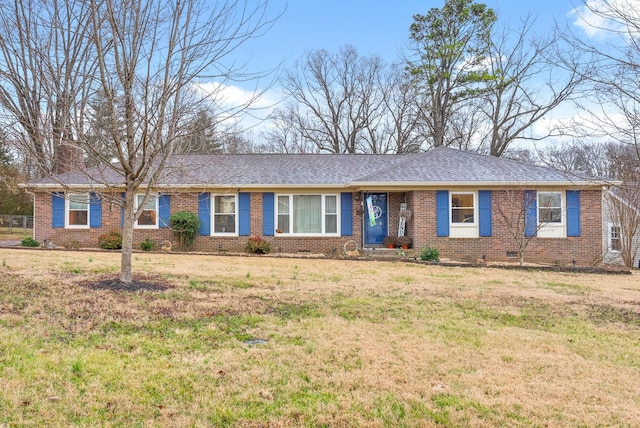 ranch-style house featuring crawl space, roof with shingles, a front lawn, and brick siding