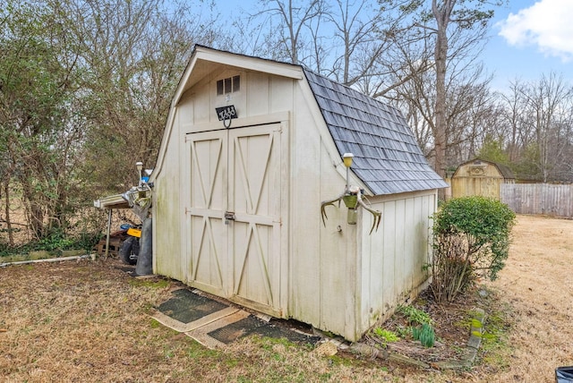 view of shed with fence