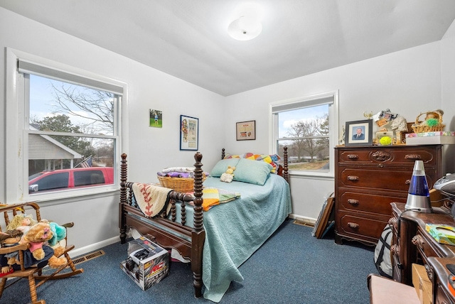 bedroom featuring carpet flooring and baseboards