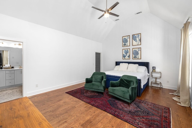 bedroom with visible vents, connected bathroom, wood finished floors, high vaulted ceiling, and baseboards