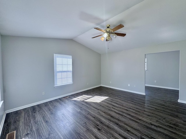 empty room featuring baseboards, visible vents, ceiling fan, and dark wood finished floors