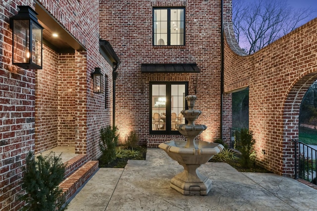 entrance to property with brick siding