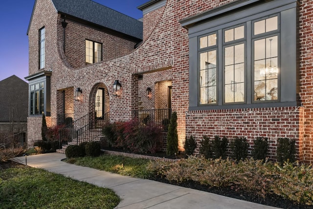 exterior space featuring brick siding