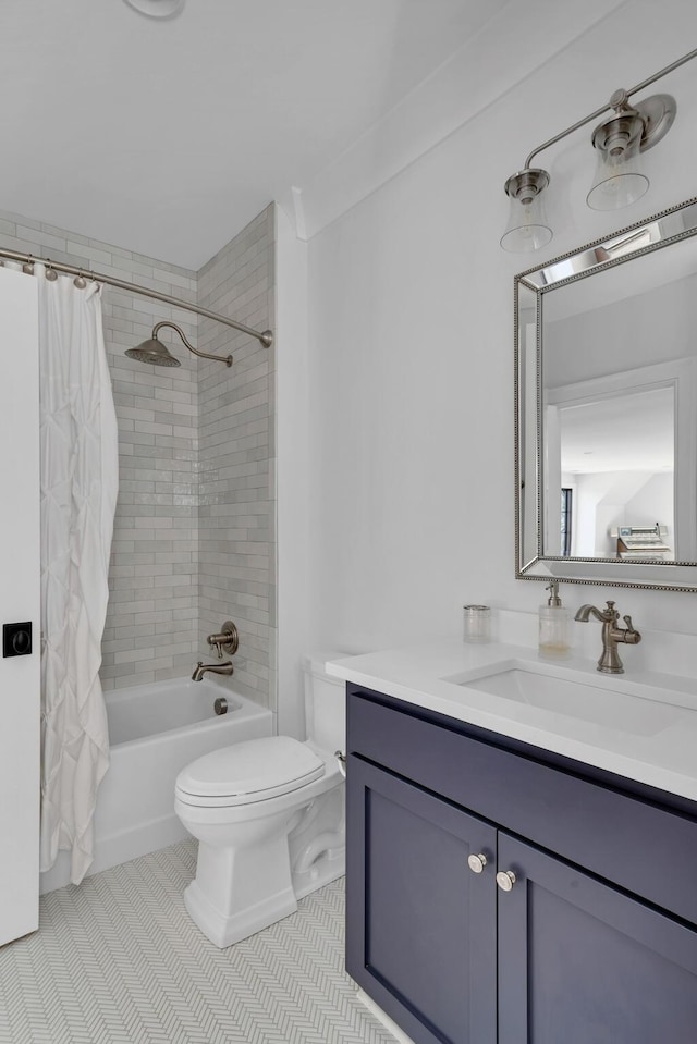 bathroom featuring shower / tub combo, tile patterned flooring, vanity, and toilet