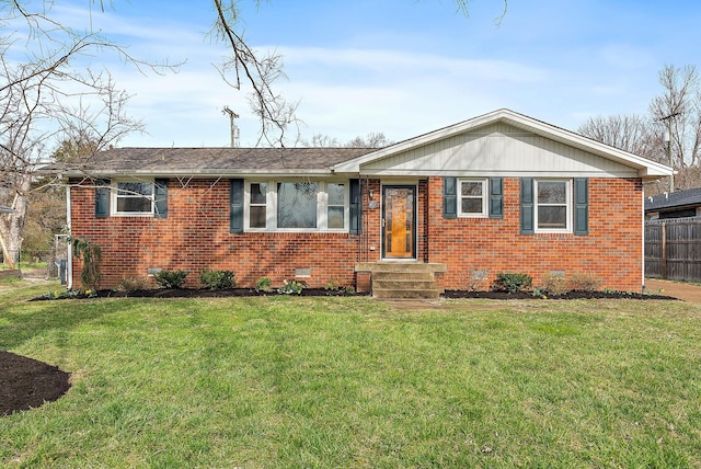 view of front of house featuring fence, brick siding, and crawl space