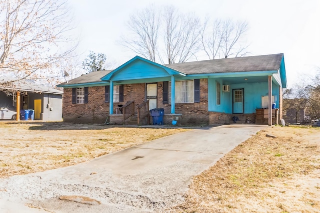 single story home featuring brick siding