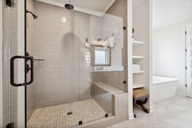 bathroom featuring a stall shower, baseboards, crown molding, and a freestanding bath