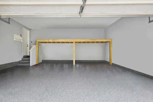 garage featuring baseboards