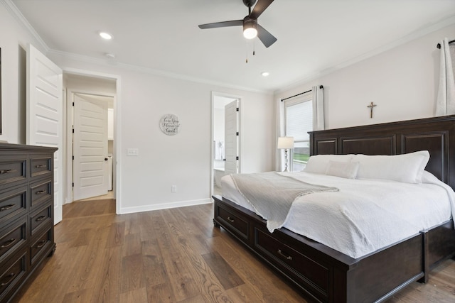 bedroom with baseboards, wood finished floors, and crown molding