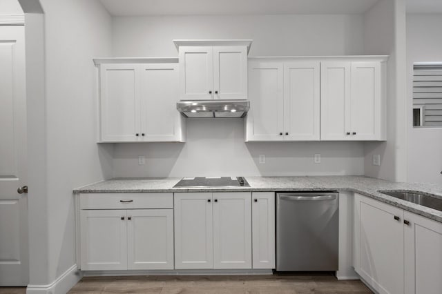 kitchen with black electric stovetop, stainless steel dishwasher, light wood-style floors, white cabinets, and under cabinet range hood