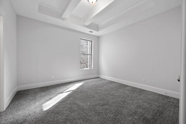 carpeted spare room featuring beamed ceiling, visible vents, and baseboards