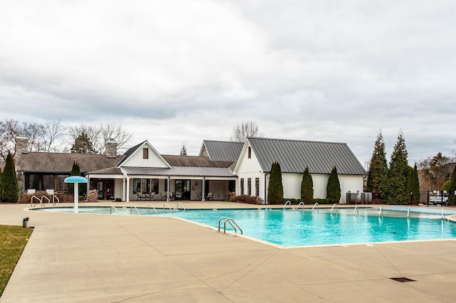 pool featuring a patio area